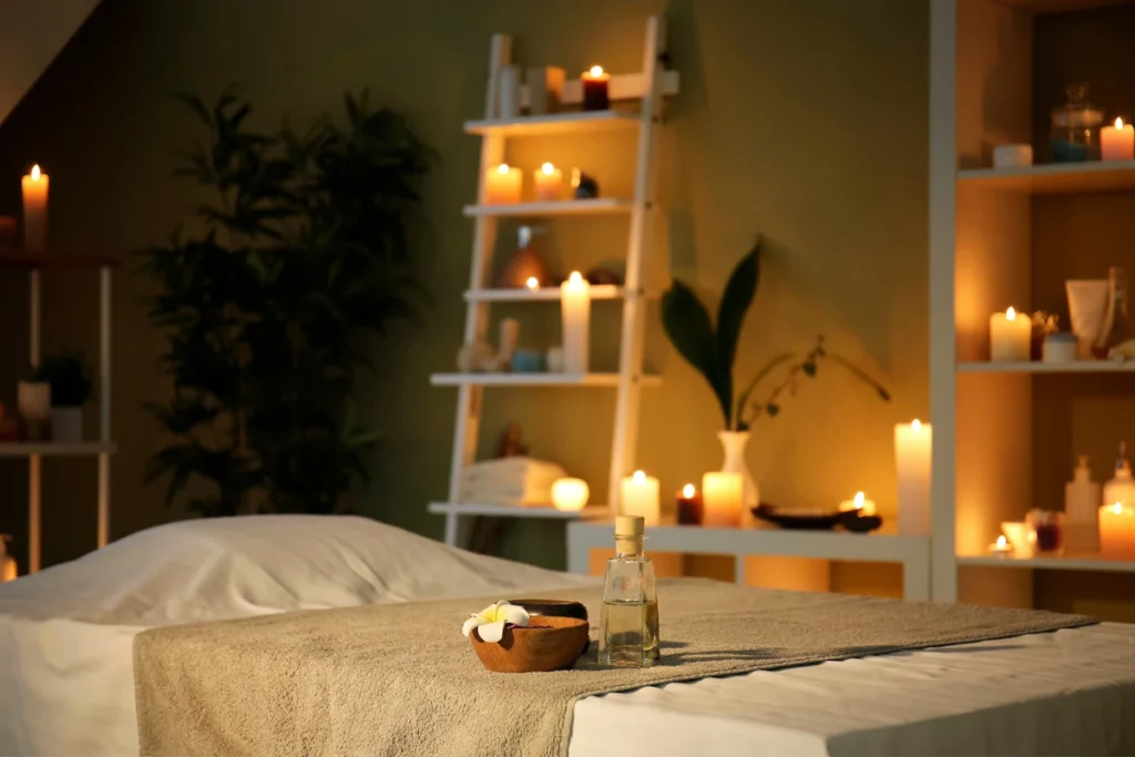 Massage room with warm candlelight and treatment table for independent massage therapists