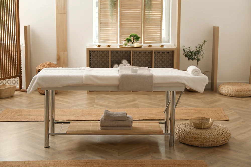 Professionally designed massage suite with single treatment table